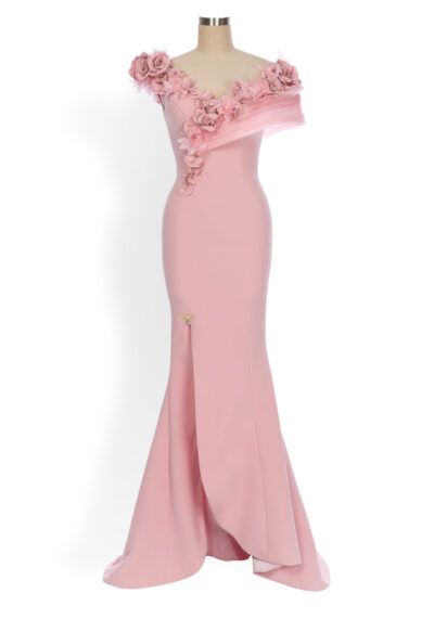 Pale pink gown with elaborate laser-cut flower detailing and a dramatic slit