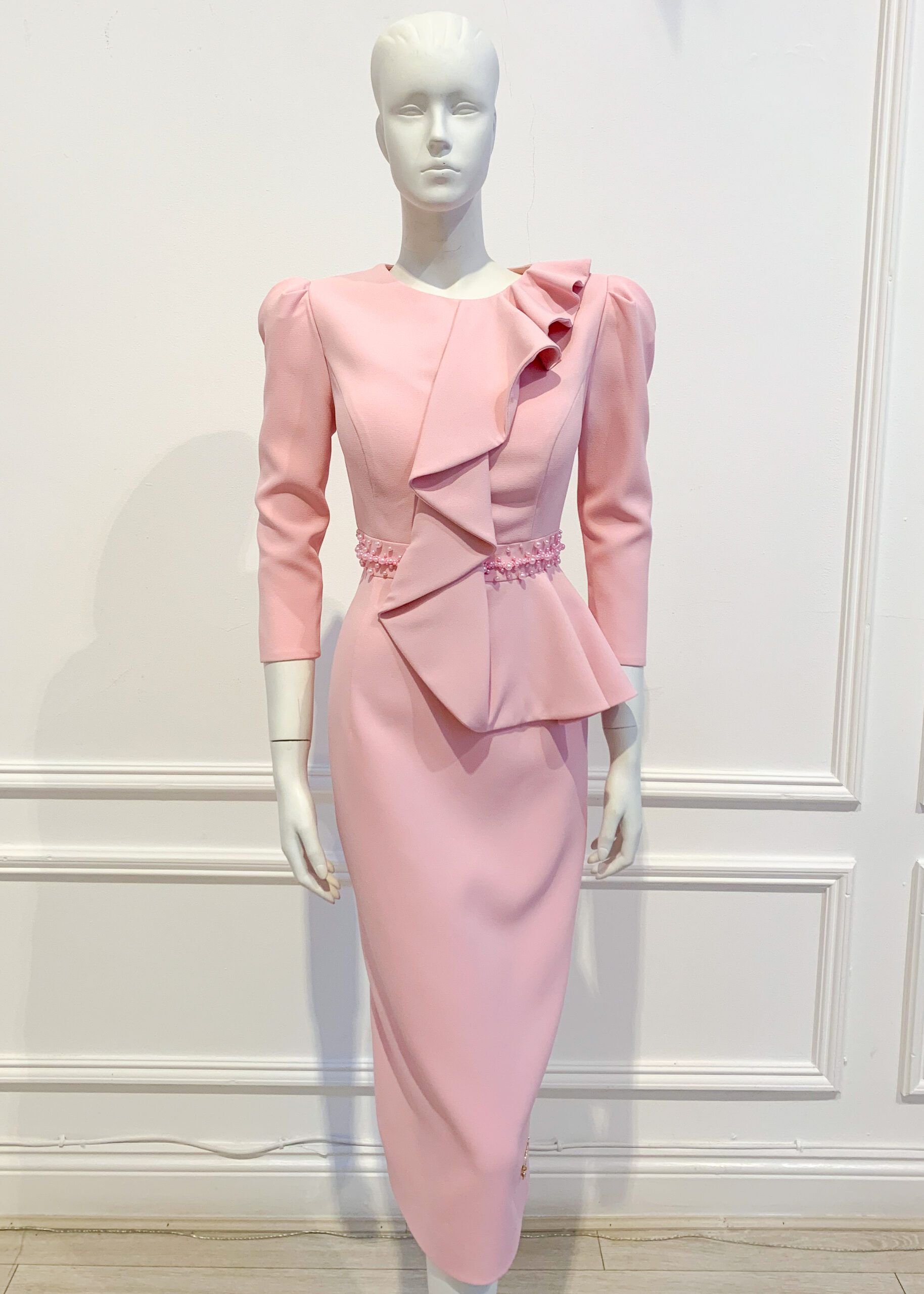Pale pink ruffle half-peplum pencil dress with pink pearl waistband and small puff shoulder